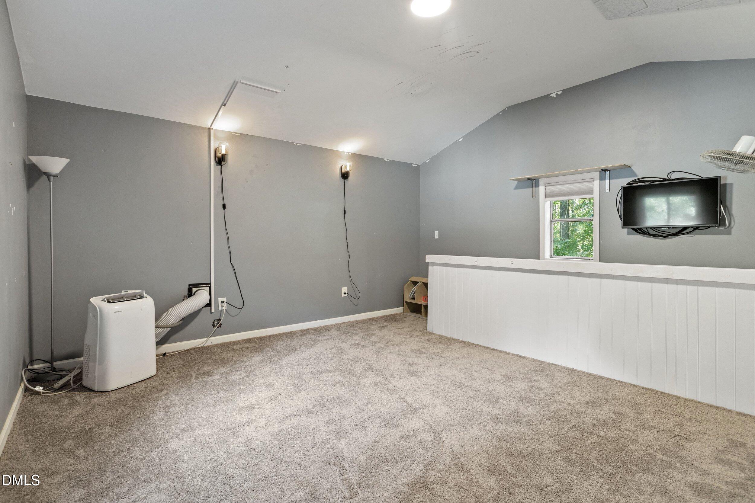 4409 Randall Road Durham, NC 27707 - Photo 31 of 33 ADU Upstairs-big enough for a Full-swing golf simulator as used by the current owner, or as a bedroom, studio, gym, flex