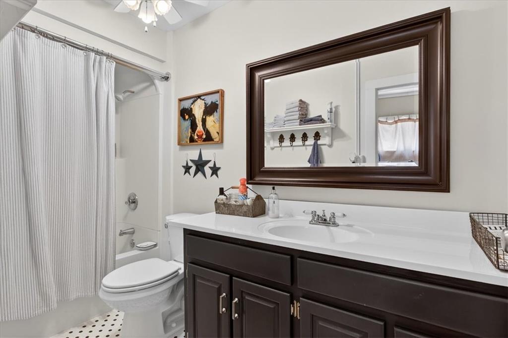 7433 Nicklesville Road Northeast Ranger, GA 30734 - Photo 23 of 53 a bathroom with a sink a toilet and a mirror
