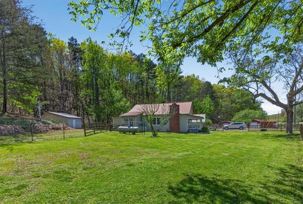 7433 Nicklesville Road Northeast Ranger, GA 30734 - Photo 29 of 53 a view of a house with a yard and sitting area