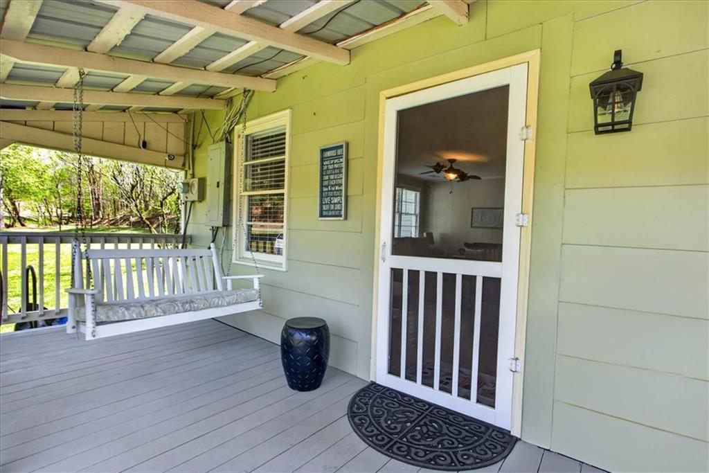 7433 Nicklesville Road Northeast Ranger, GA 30734 - Photo 5 of 53 a view of porch with a door and wooden floor