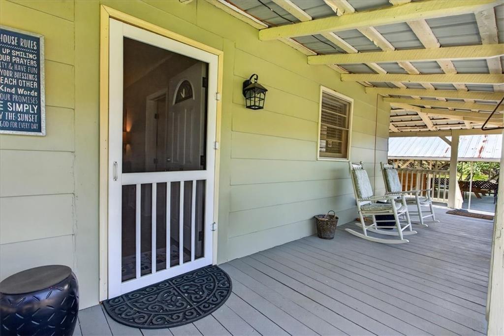 7433 Nicklesville Road Northeast Ranger, GA 30734 - Photo 6 of 53 a view of a balcony with chair and wooden floor