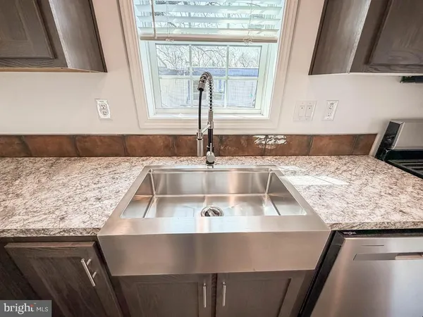a kitchen with a sink and a window