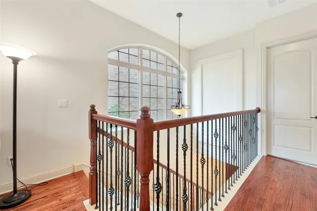 a view of a hallway with windows