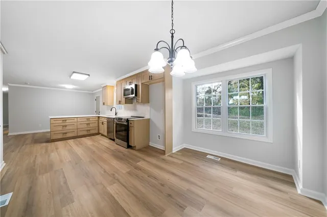 a view of a livingroom with wooden floor