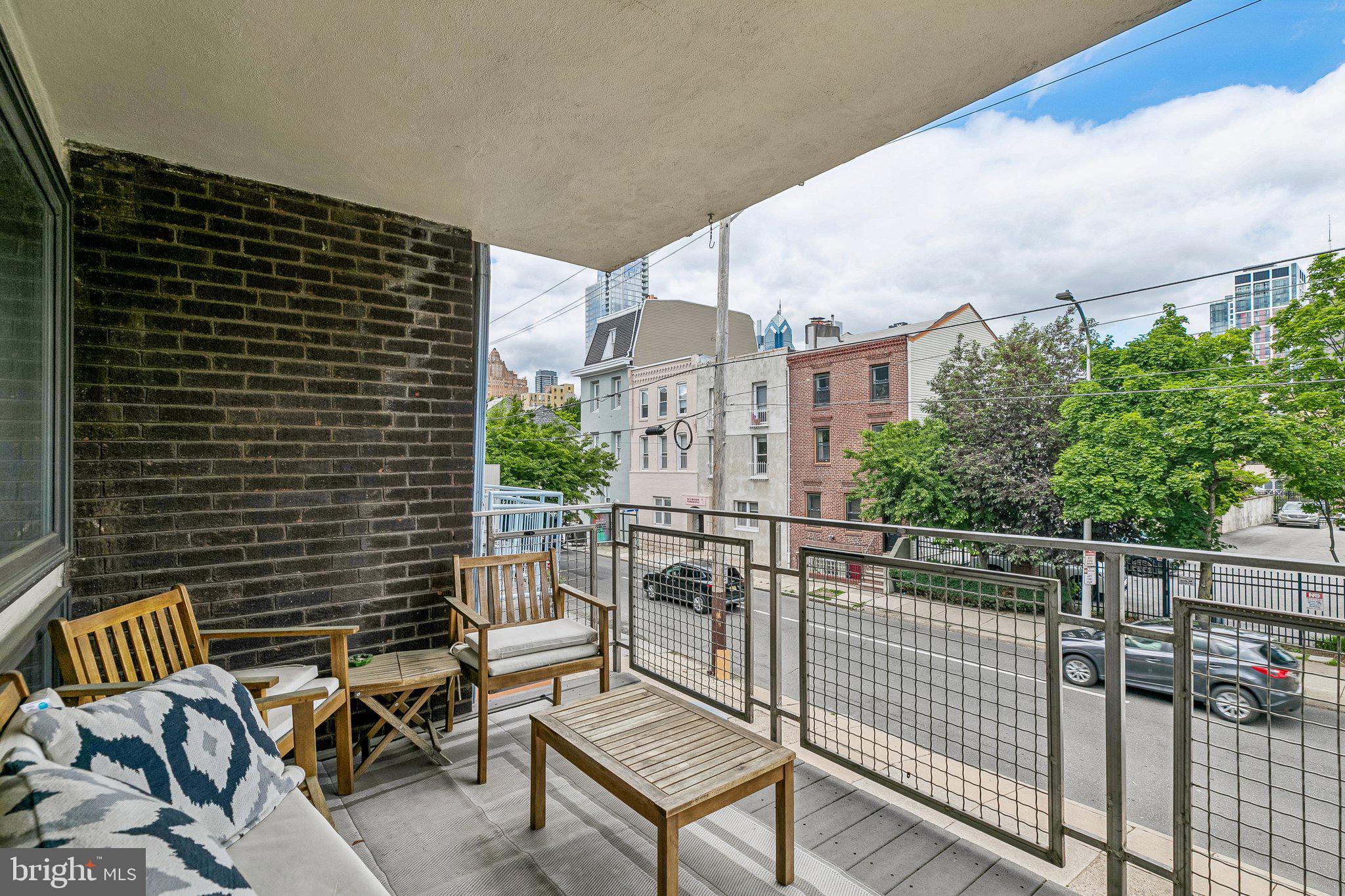 1130 Lombard Street Philadelphia, PA 19147 - Photo 15 of 45 a view of balcony with two chairs and a potted plant
