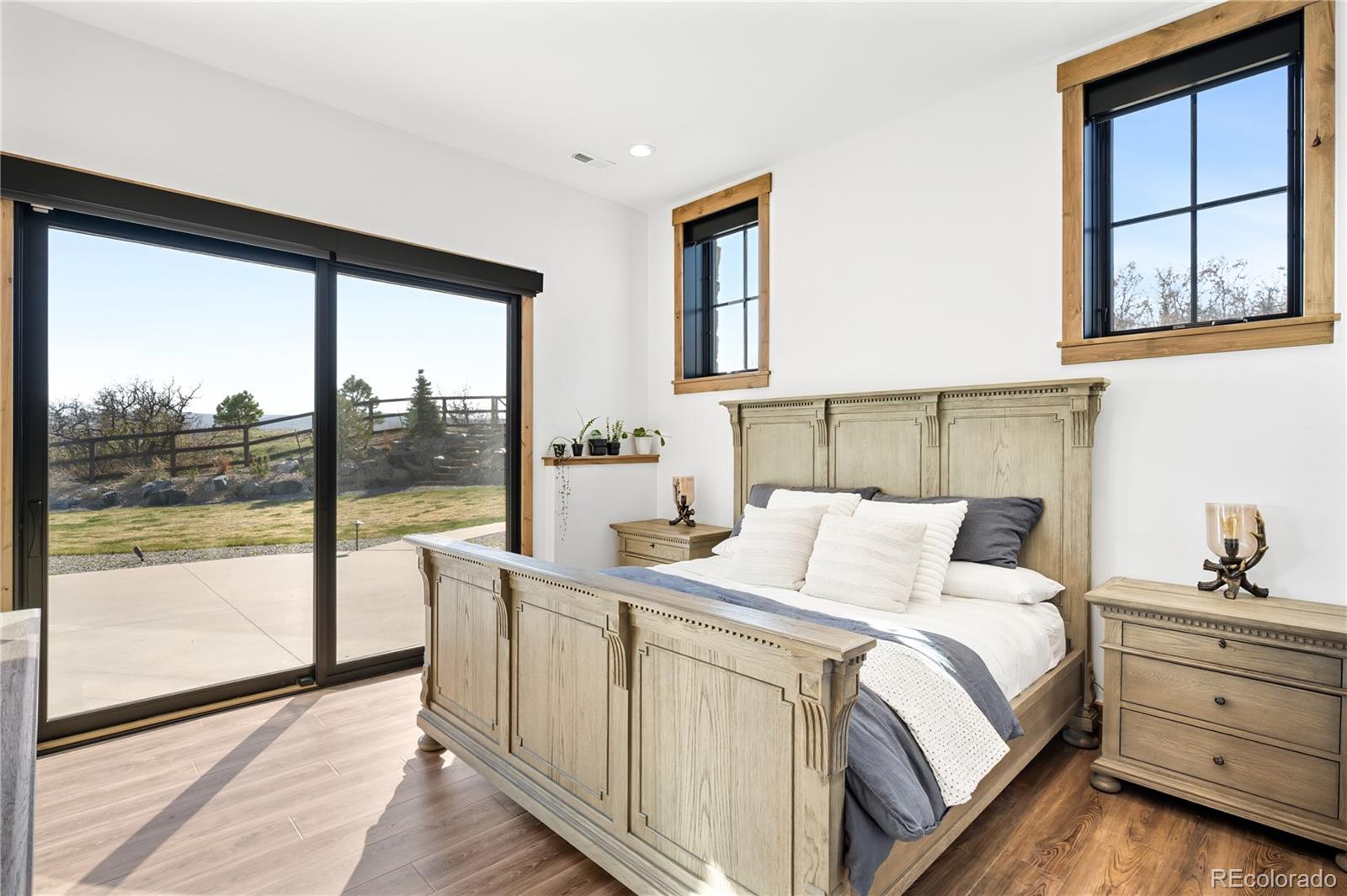 3148 Keep Drive Sedalia, CO 80135 - Photo 27 of 44 a bedroom with a bed and a large window