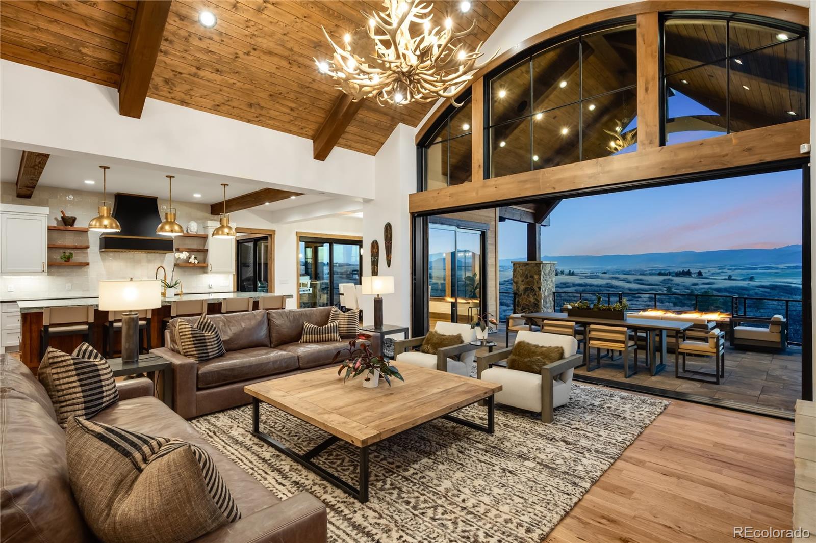 3148 Keep Drive Sedalia, CO 80135 - Photo 3 of 44 a living room with furniture and a fireplace