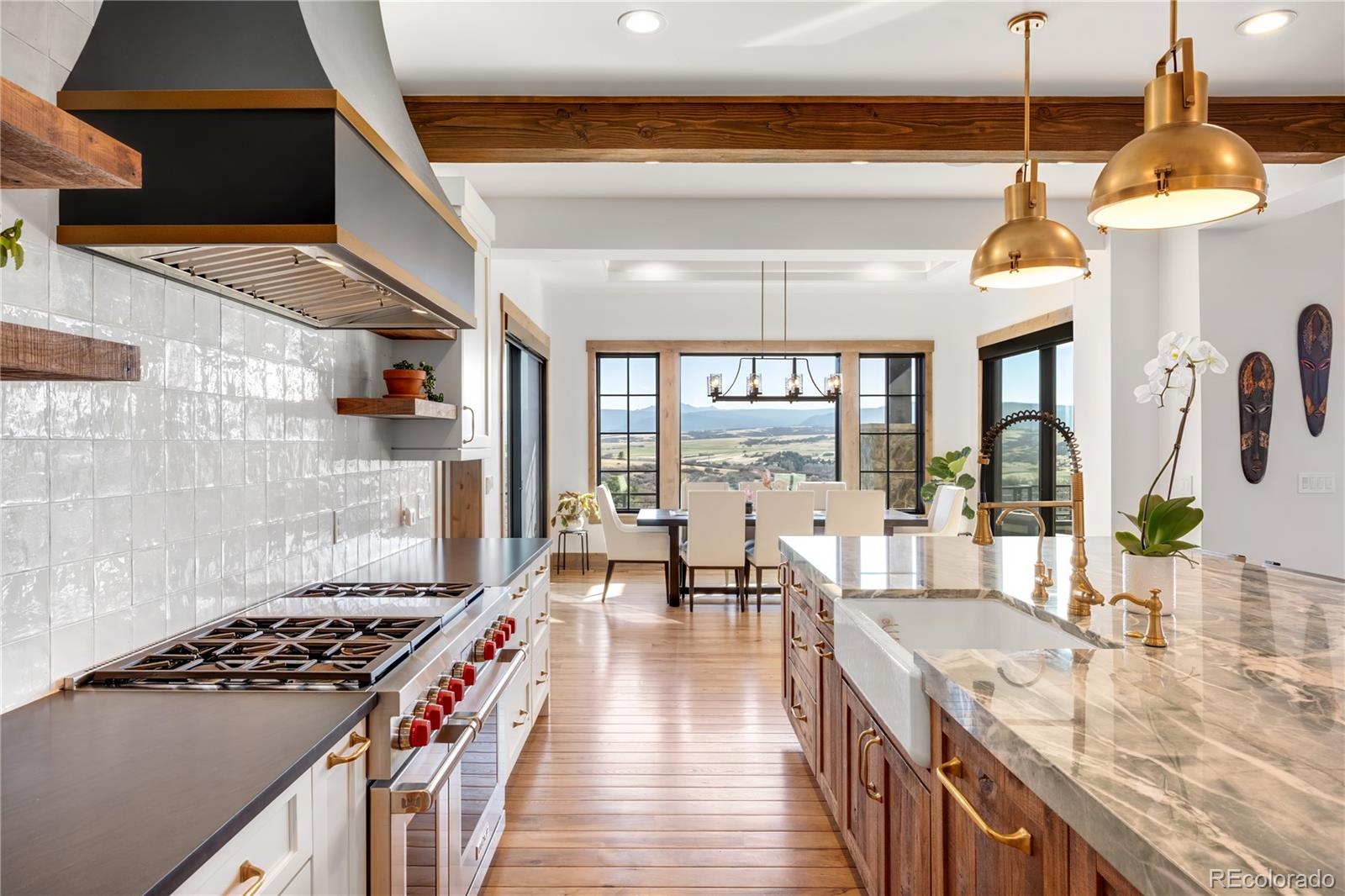 3148 Keep Drive Sedalia, CO 80135 - Photo 7 of 44 a kitchen with stove and a view of living room