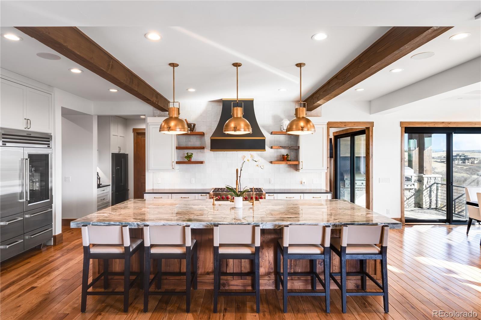 3148 Keep Drive Sedalia, CO 80135 - Photo 9 of 44 a view of a dining room with furniture and wooden floor