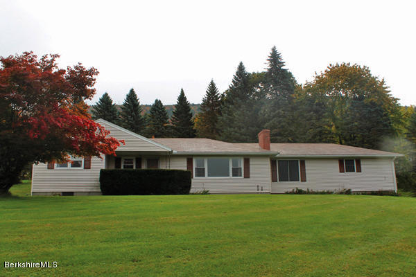 265 Yokun Road Richmond, MA 01201 - Photo 2 of 24 a front view of a house with a garden