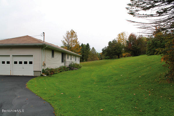 265 Yokun Road Richmond, MA 01201 - Photo 22 of 24 a view of a house with a backyard