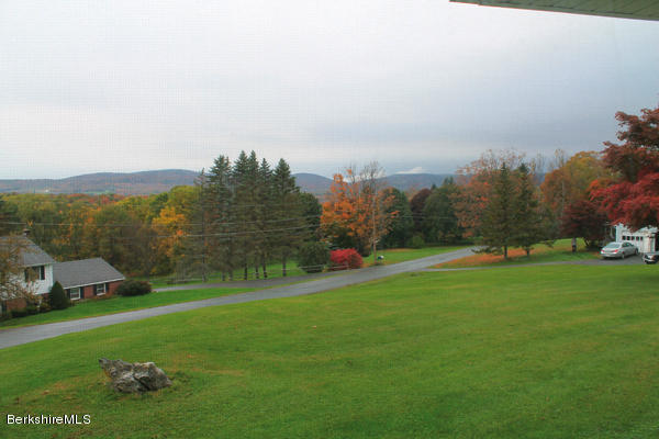 265 Yokun Road Richmond, MA 01201 - Photo 5 of 24 a view of a green field with sky view