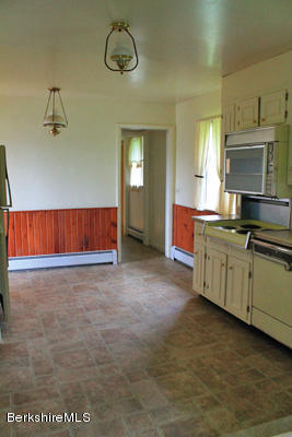 265 Yokun Road Richmond, MA 01201 - Photo 6 of 24 a kitchen with cabinets and window