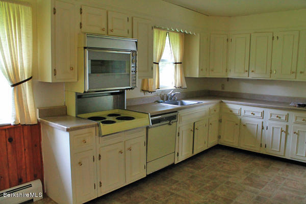 265 Yokun Road Richmond, MA 01201 - Photo 8 of 24 a utility room with cabinets washer and dryer