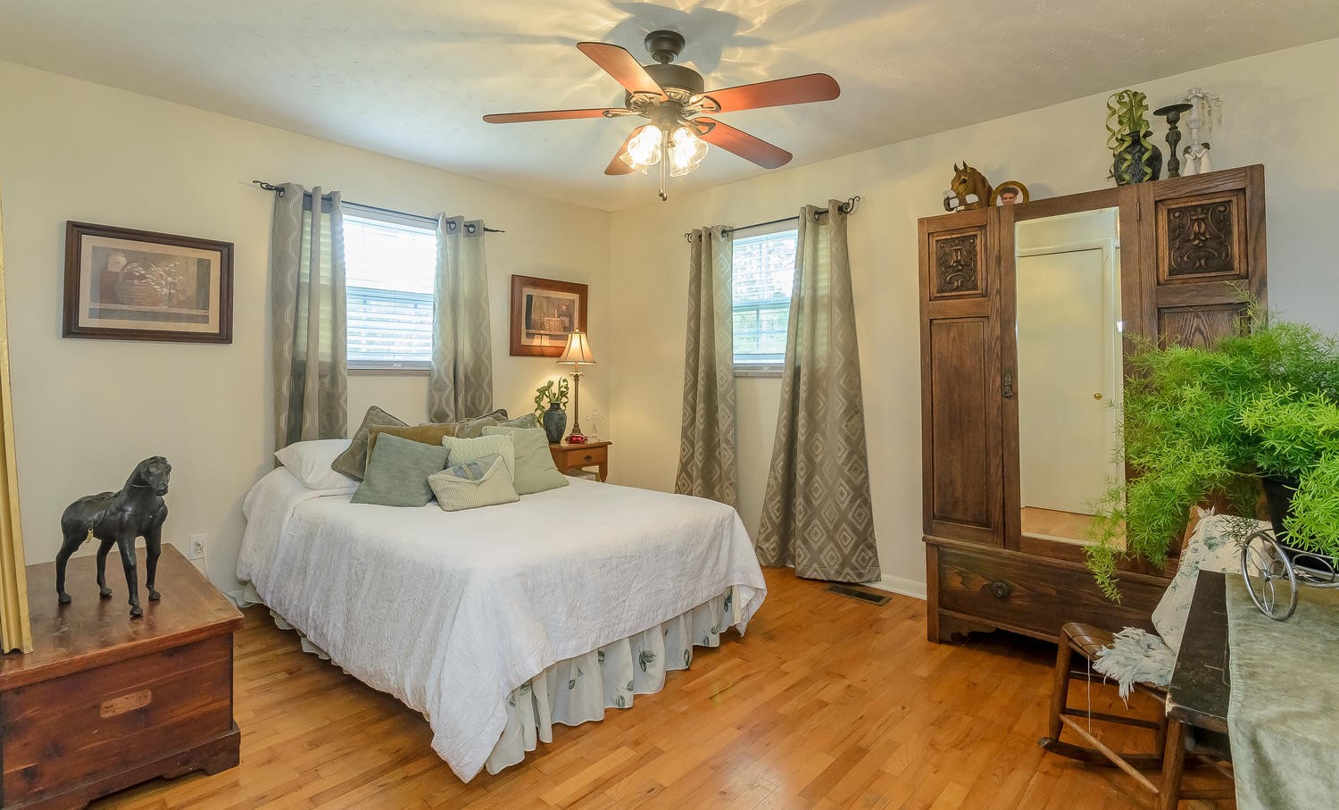 8321 Shelton Road Corryton, TN 37721 - Photo 14 of 28 a bedroom with a bed and a chandelier