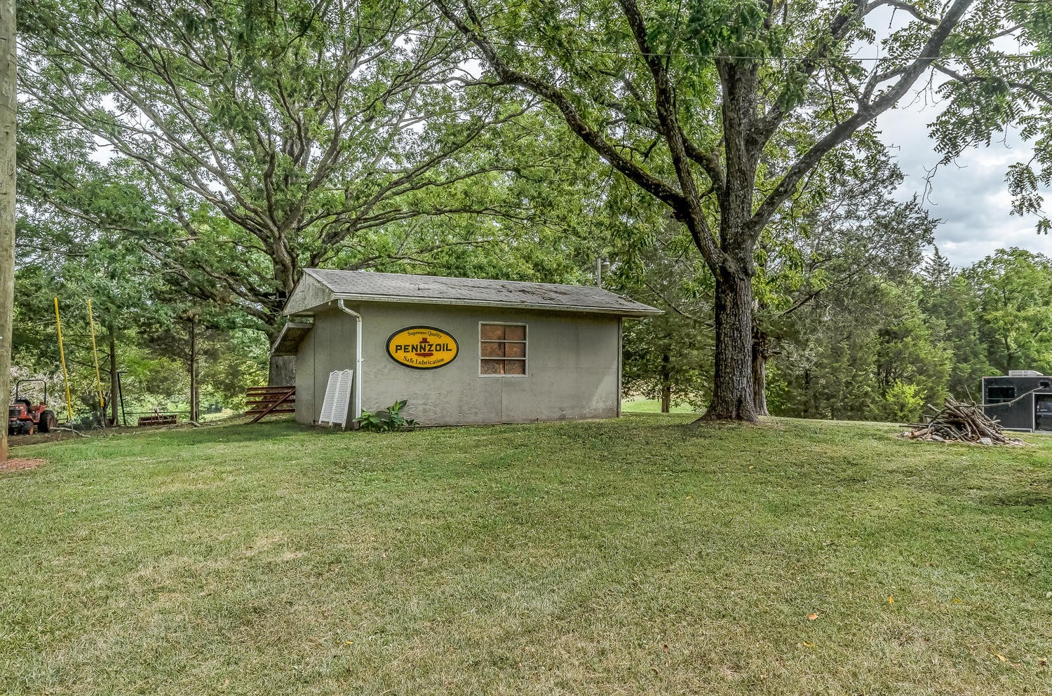 8321 Shelton Road Corryton, TN 37721 - Photo 20 of 28 a house with trees in front of it