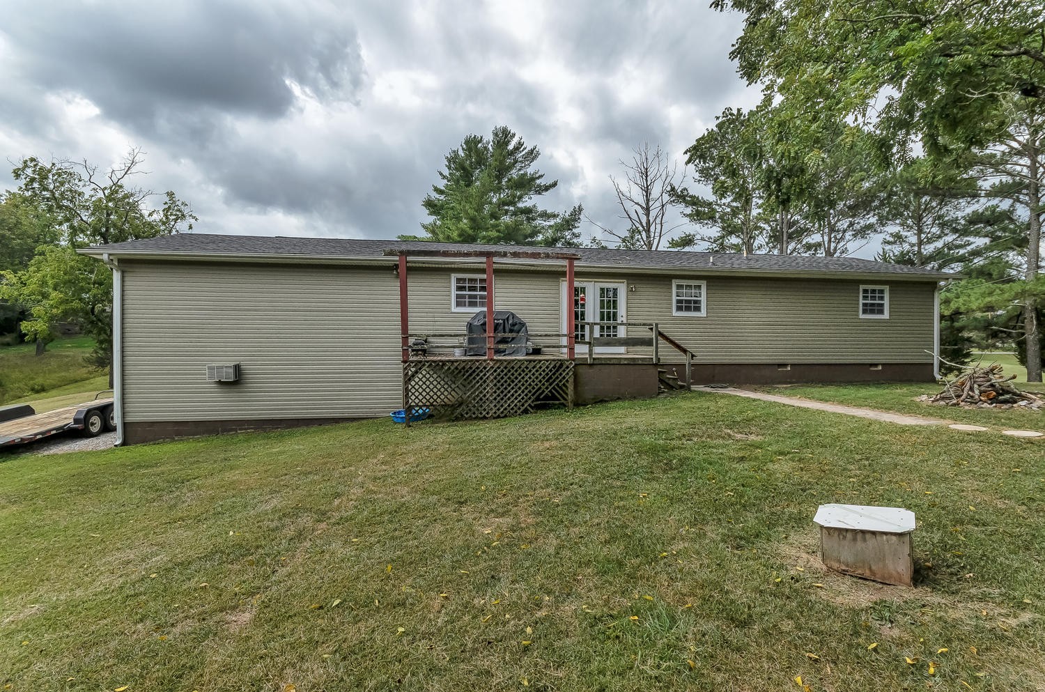 8321 Shelton Road Corryton, TN 37721 - Photo 27 of 28 a backyard of a house with table and chairs