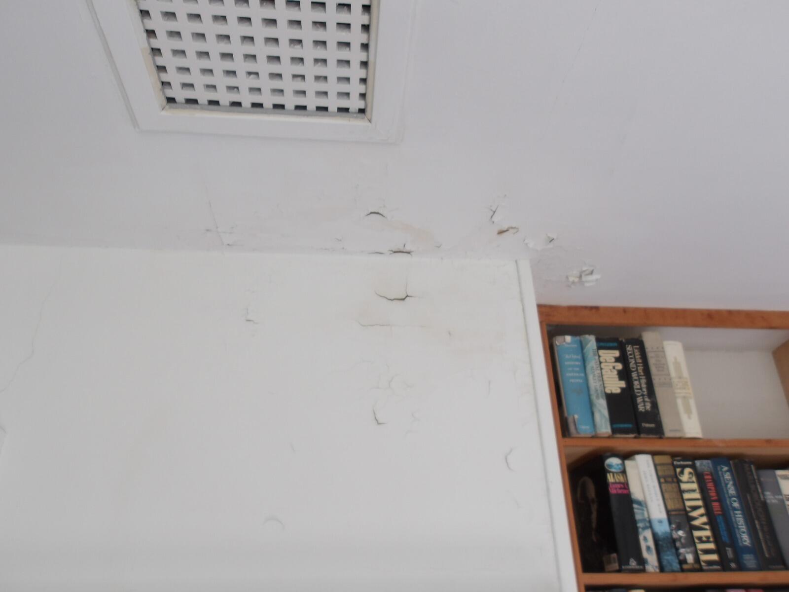 881 Pond Road Gouldsboro, ME 04607 - Photo 52 of 69 Peeling paint-living room chimney