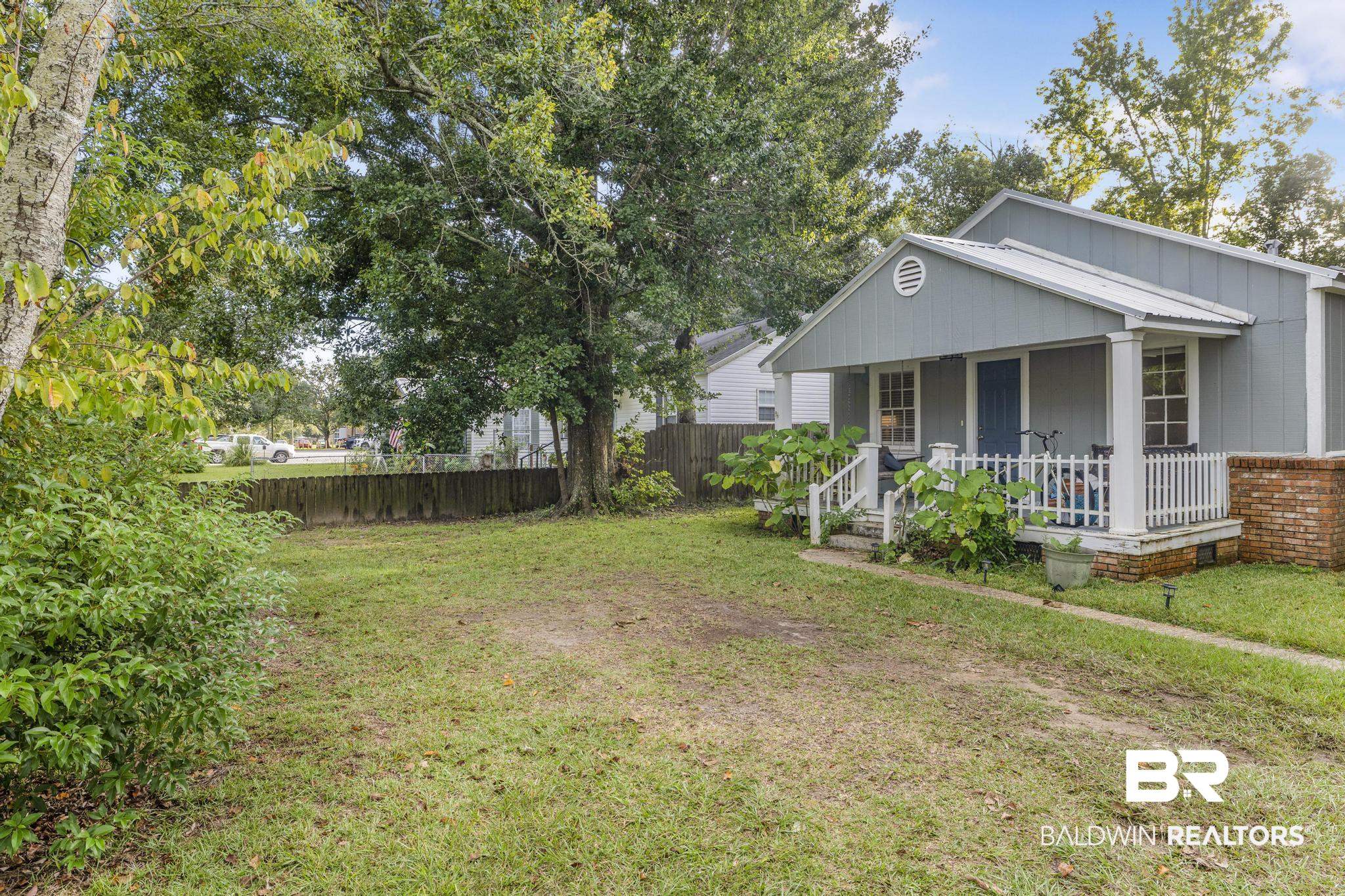 405 North Pine Street Foley, AL 36535 - Photo 9 of 33 View of yard with covered porch