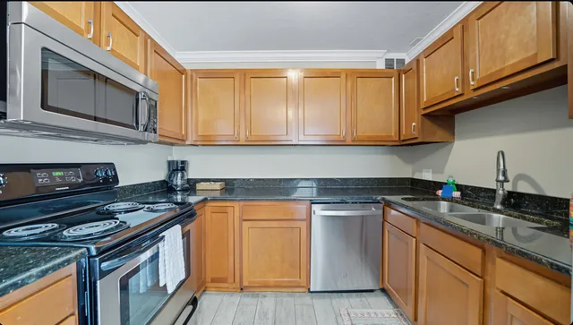 a kitchen with a stove and a microwave
