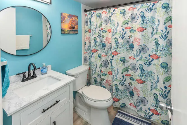 a bathroom with a toilet and a sink