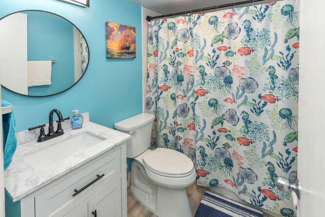 150 Pineview Road, Unit L6 Jupiter, FL 33469 - Photo 14 of 22 a bathroom with a toilet and a sink