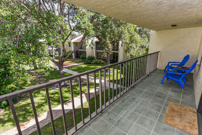 150 Pineview Road, Unit L6 Jupiter, FL 33469 - Photo 16 of 22 a view of a two chairs in the balcony
