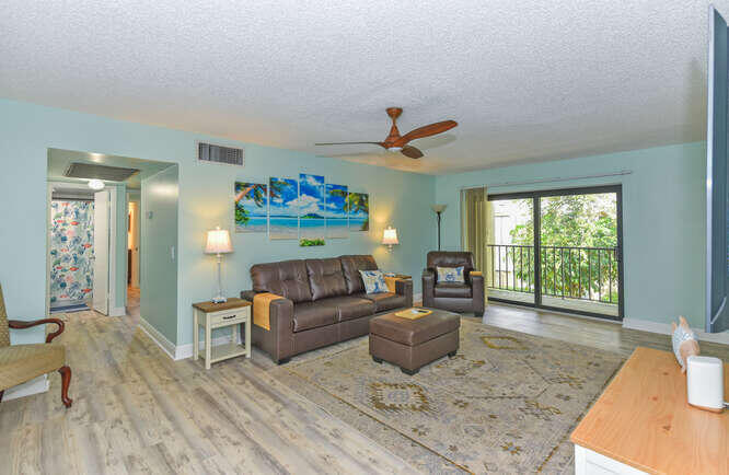 150 Pineview Road, Unit L6 Jupiter, FL 33469 - Photo 2 of 22 a living room with furniture and a wooden floor