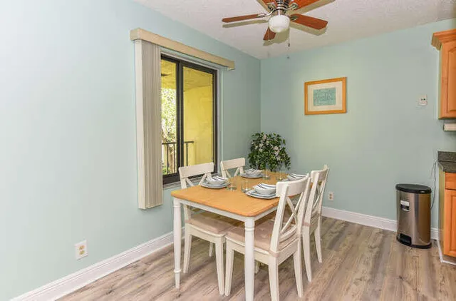 a dining room with furniture and window