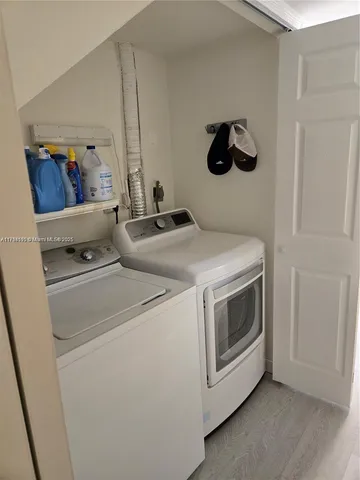 a utility room with dryer and washer