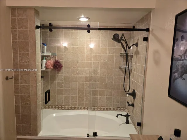 a bathroom with a shower and a bathtub