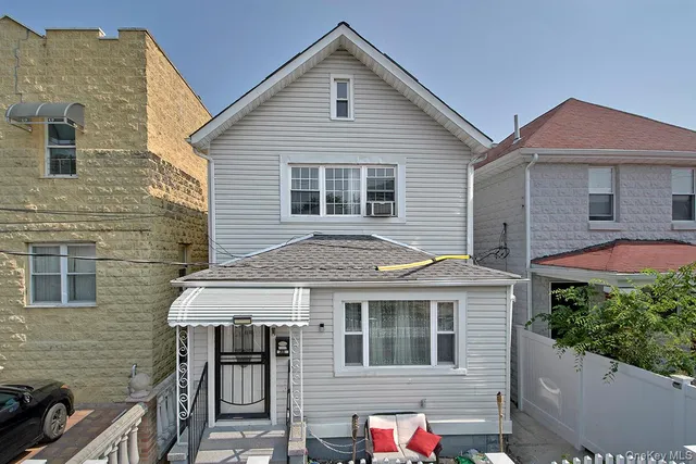 a front view of a house with yard