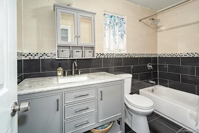 a bedroom with a bed and glass window