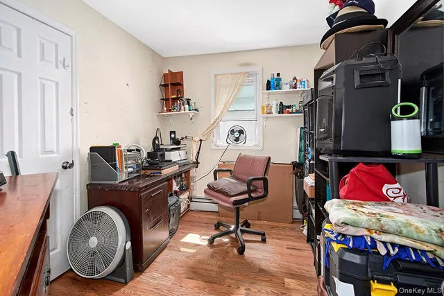 a bathroom with a granite countertop sink a toilet and a mirror