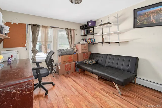 a bedroom with furniture and a window