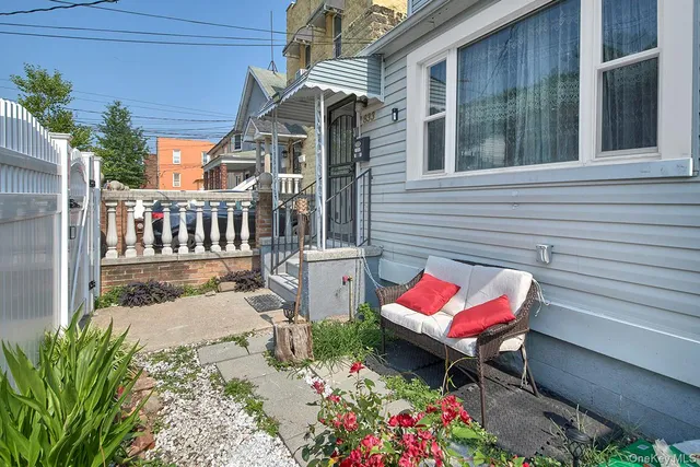 a view of a two chairs in the patio