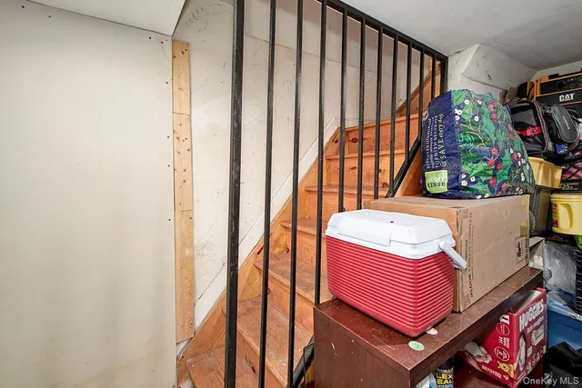 a bathroom with a toilet a sink and a mirror