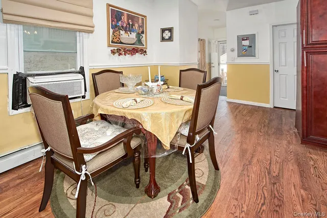 a view of a dining room with furniture and a window