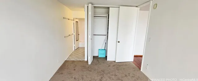 a bathroom with a sink and mirror with bathtub