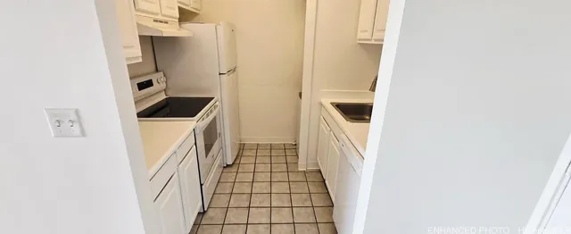 a utility room with sink dryer and washer