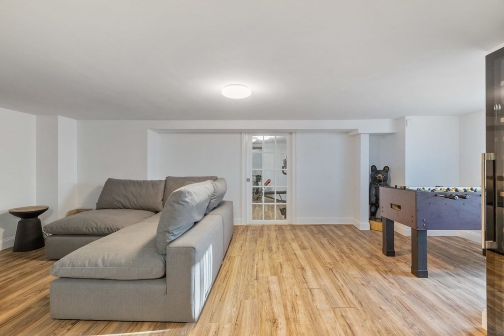 23 Thomas Road Wellesley, MA 02482 - Photo 20 of 23 a living room with furniture and a wooden floor