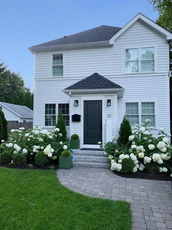 23 Thomas Road Wellesley, MA 02482 - Photo 22 of 23 a front view of a house with a garden