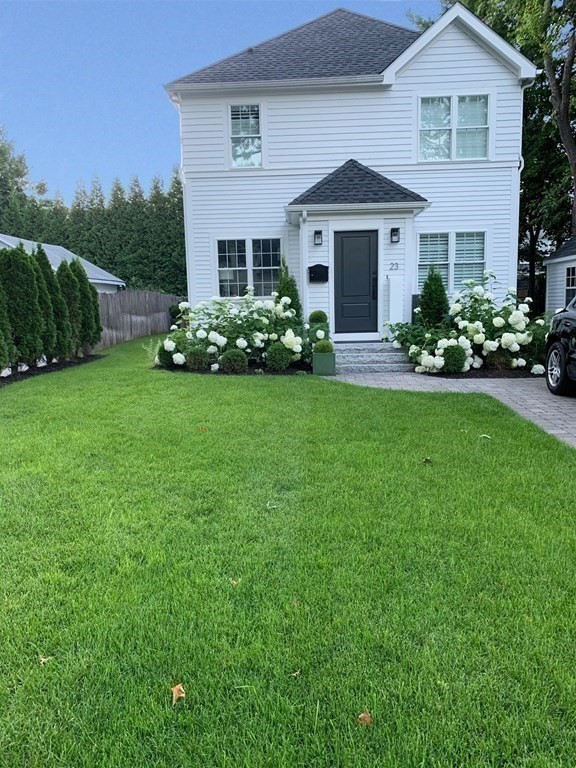 23 Thomas Road Wellesley, MA 02482 - Photo 23 of 23 a front view of a house with a yard
