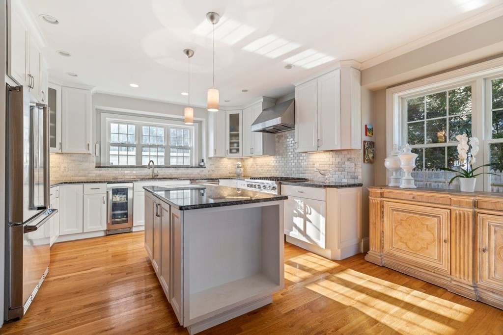 23 Thomas Road Wellesley, MA 02482 - Photo 9 of 23 a kitchen with stainless steel appliances granite countertop hardwood floor sink stove and granite counter top