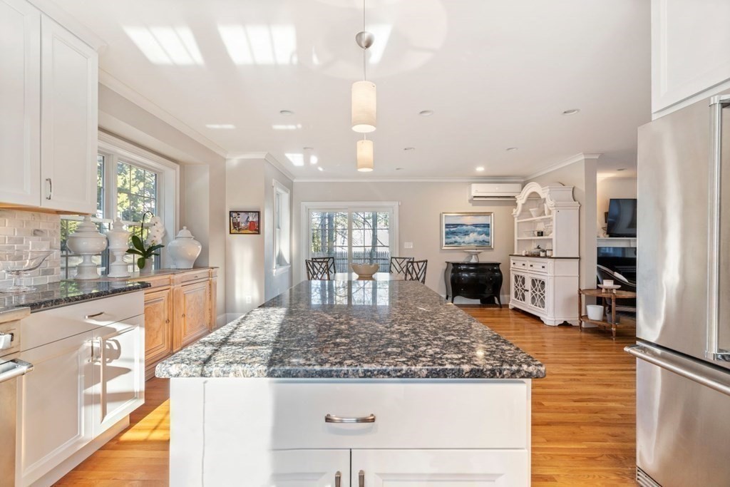 23 Thomas Road Wellesley, MA 02482 - Photo 10 of 23 a kitchen with stainless steel appliances granite countertop a sink stove and refrigerator