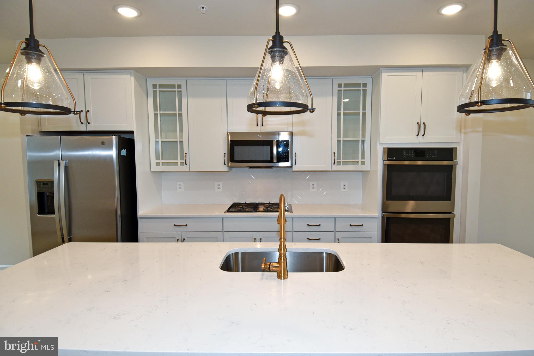 402 Matlock Lane Frederick, MD 21701 - Photo 23 of 61 quarts countertop and gold hardware