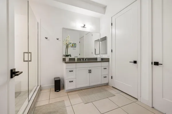 a view of a workspace with furniture and wooden floor