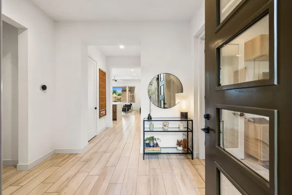 a spacious bathroom with a double vanity sink and a mirror