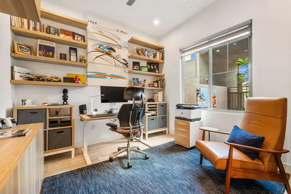 a yellow house with trees in front of it