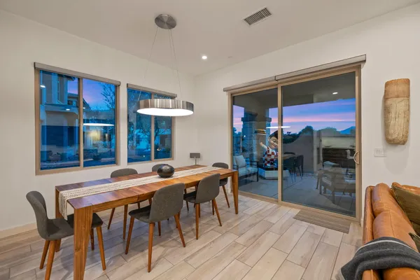 a view of a dining room with furniture window and outside view